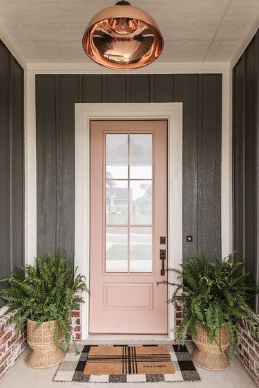 Front porch with blush pink door