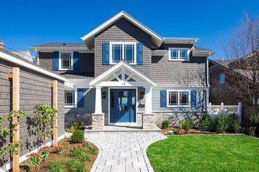 gray shingled home with navy acents