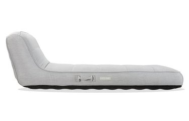A gray seated lounger with a back.