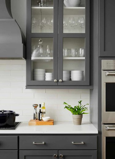 slate gray kitchen cabinets with white subway tile backsplash