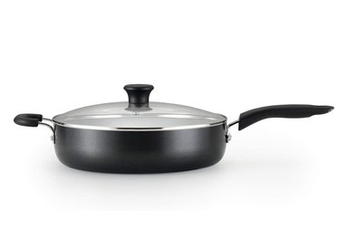 Ceramic nonstick cookware pan with silver details and lid