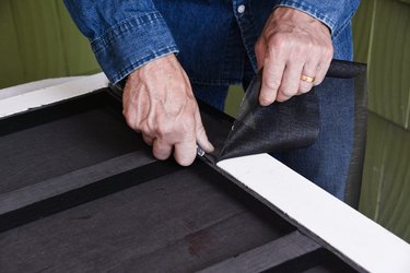 trimming door screen with a utility knife