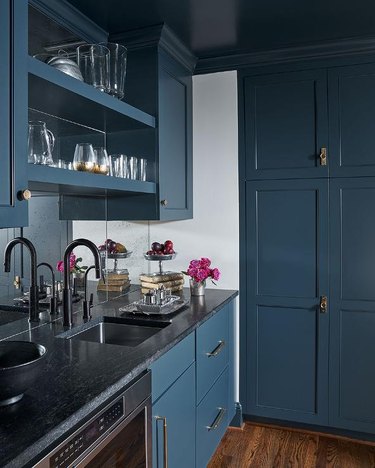 Blue Pantry Cabinets with Brass Hardware