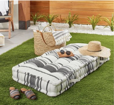 outdoor floor pillow with beach essentials