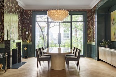 dining room with teal walls and brown wallpaper