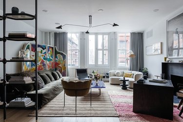 living room gray sofa with brown and taupe area rug