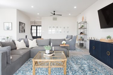 gray sectional sofa and teal area rug