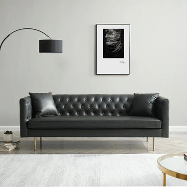 black faux leather sofa