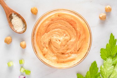 Buffalo sauce in small glass bowl