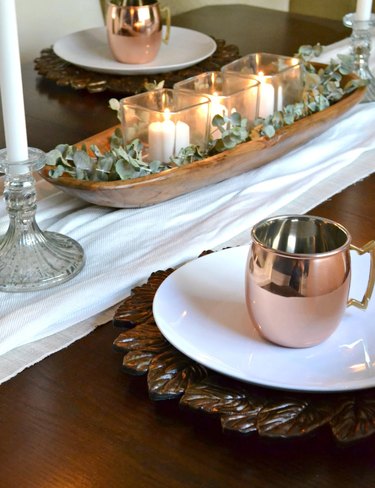 dough bowl centerpiece with eucalyptus and candles