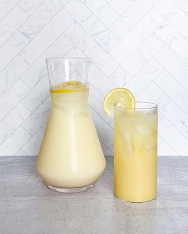 creamy lemonade in pitcher and glass