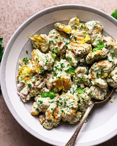 The Curious Chickpea Smashed Potato Herbed Salad