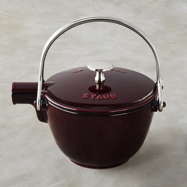 Deep red cast iron kettle