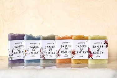 Six soaps each in a different color with the names James and Emily written on the packaging