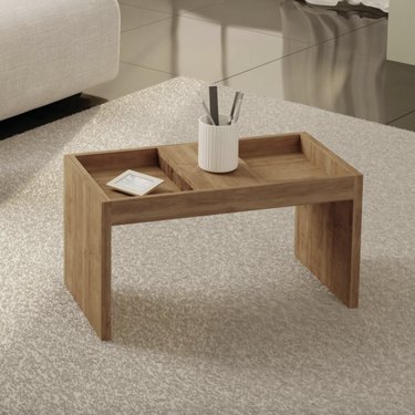 Square wooden coffee table with cubbies