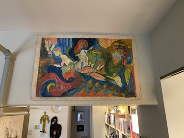 Leyden Lewis home with painting hung on wall