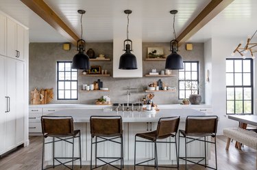 Farmhouse kitchen with wood beams and textured backsplash