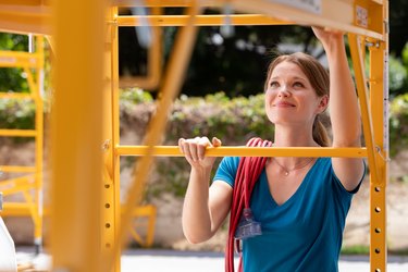 woman working on scaffolding