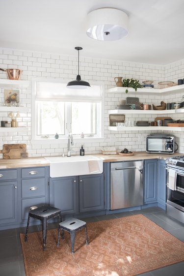 Farmhouse kitchen with white subway tile by Jessica McCarthy
