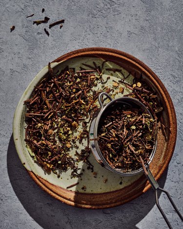 Dry tea on a brown plate