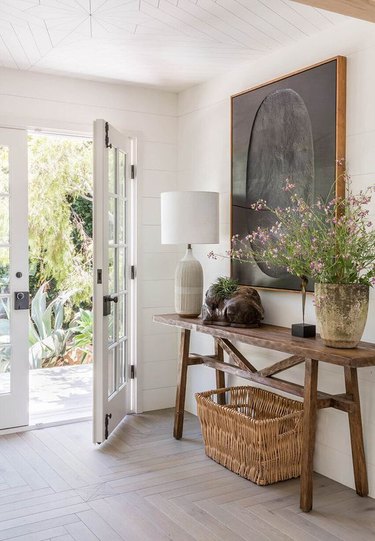 farmhouse entryway with console table and oversize artwork