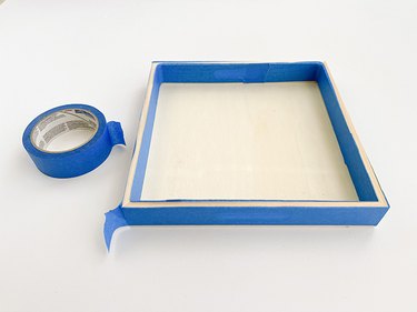 Cover the rim of the tray on both the inside and outside with painter's tape.