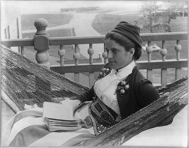 A woman in a hammock at the Kineo House in Maine, photographed by Joseph John Kirkbride.