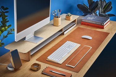 leather desk pad on desk with computer and supplies