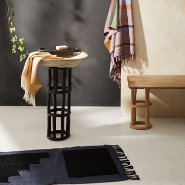 bathroom with mat and towel