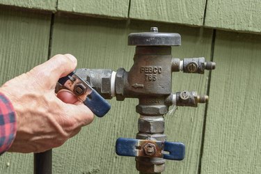 closing sprinkler system flow valve at backflow preventer