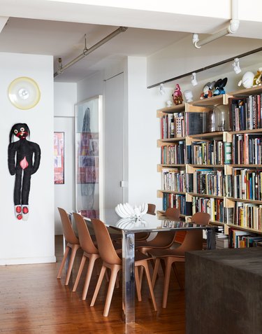 Leyden Lewis dining room with floor to ceiling bookcase