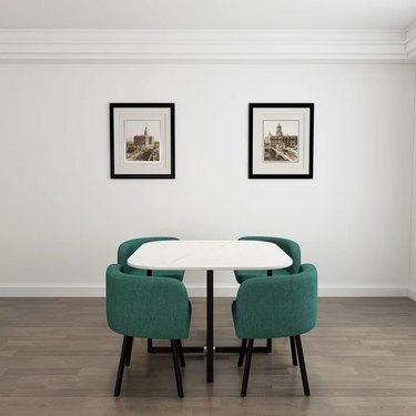 white table with green chairs