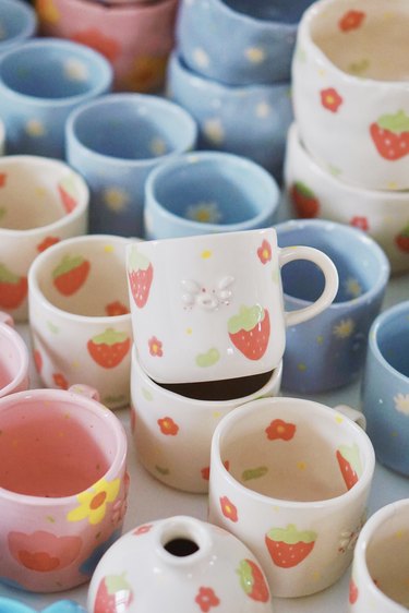 mugs in bright colors and patterns