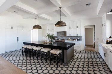 all white kitchen with honeycomb tile