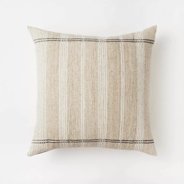 Beige square throw with thick subtle stripes