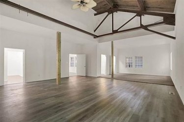 Large empty room with ceiling beams