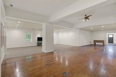 Large empty room with wood floors