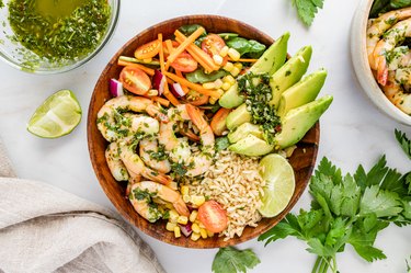 An overhead shot of the entire chimichurri shrimp bowl filled with veggies and rice.