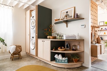 laundry room with curved shelves