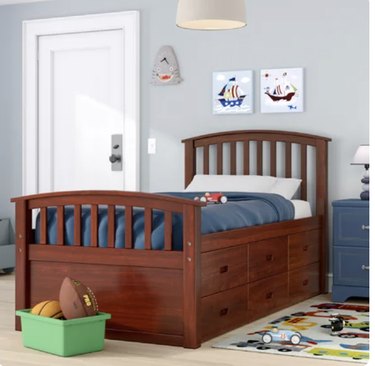 Image of wooden bed with storage drawers underneath
