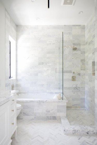 An entirely white marble bathroom.