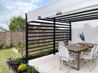 Outdoor dining table under a pergola