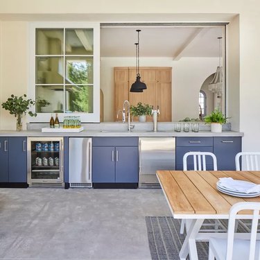 Navy cabinets in an outdoor bar.