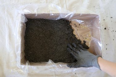 Pressing hypertufa mixture into bottom of mold