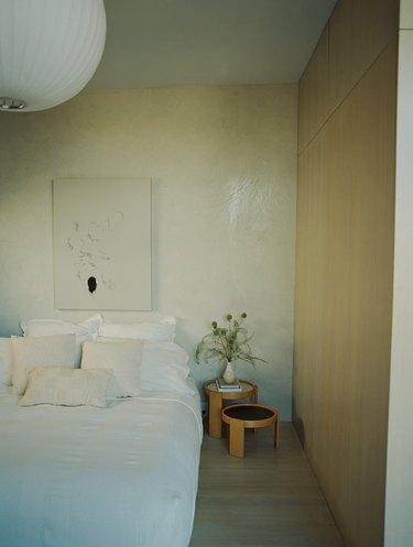 The primary bedroom features a white oak wardrobe.