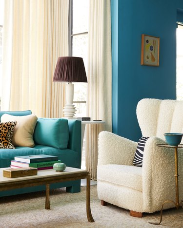 teal and aqua living room with boucle chair