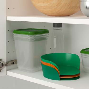 Three bowls stacked in a cabinet