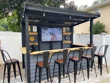 backyard bar with TV and barstools