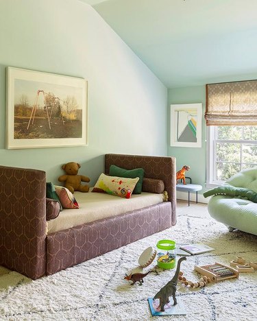 kids' room with plum daybed and mint green walls