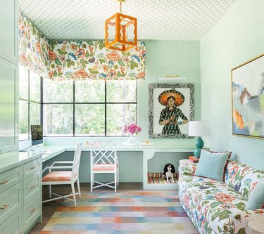 mint green home office with bright orange accents